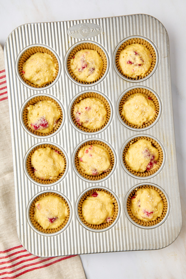 overhead view of lemon raspberry muffins in a muffin pan ready to go into the oven