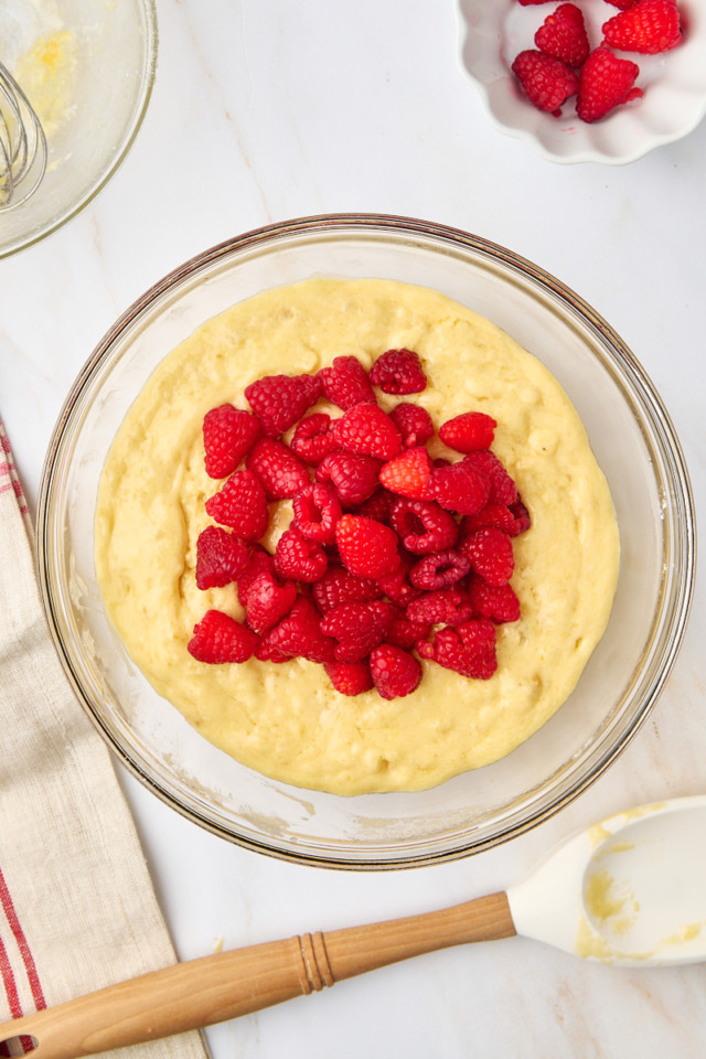 overhead view of raspberries added to muffin batter