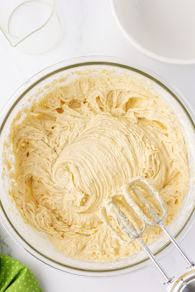 overhead view of mixed citrus cake batter in a mixing bowl