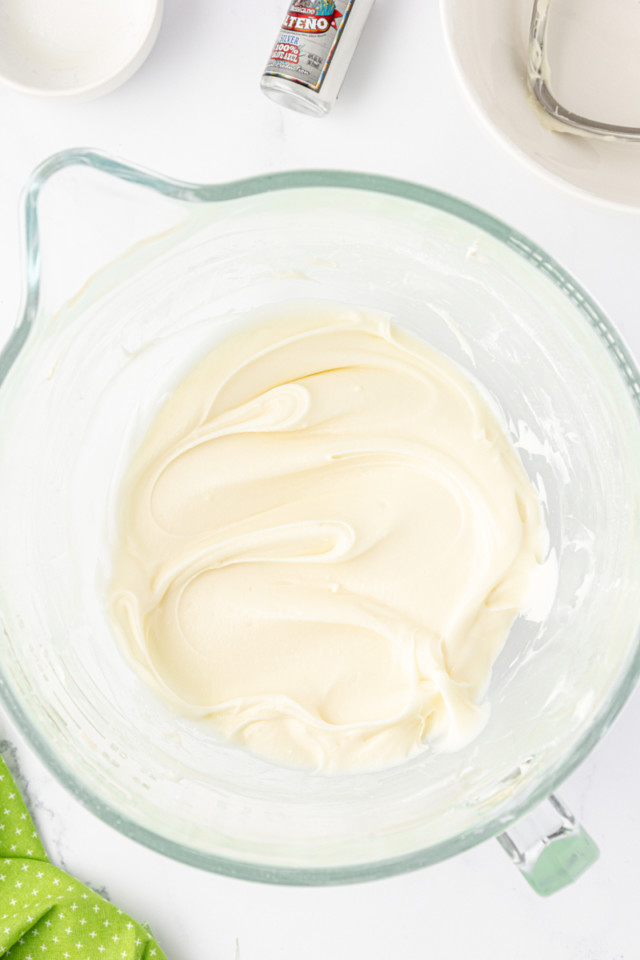 overhead view of tequila-lime frosting in a mixing bowl