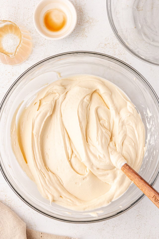 overhead view of no-bake Bailey's cheesecake filling in a glass mixing bowl