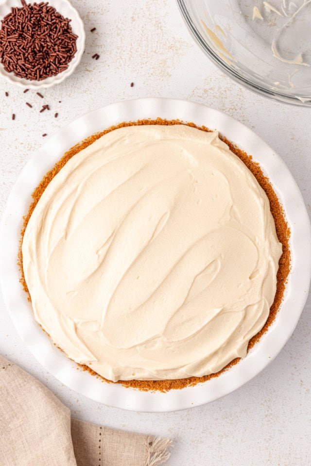 overhead view of no-bake Bailey's cheesecake in a white pie plate