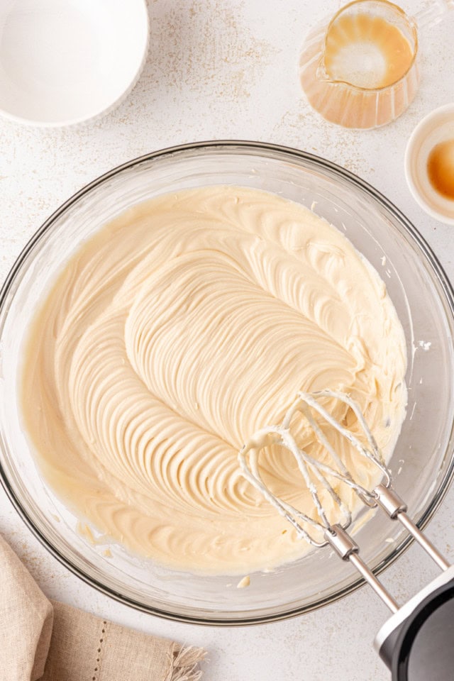 overhead view of mixed cream cheese, sugar, Bailey's, and vanilla