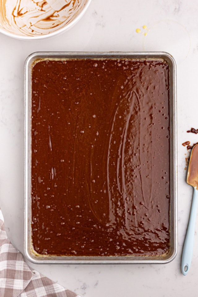 overhead view of Texas sheet cake batter in a rectangular pan, ready to go into the oven