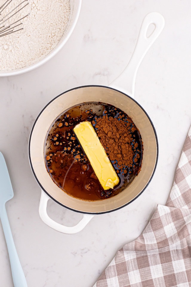 overhead view of butter, oil, water, and cocoa powder in a saucepan