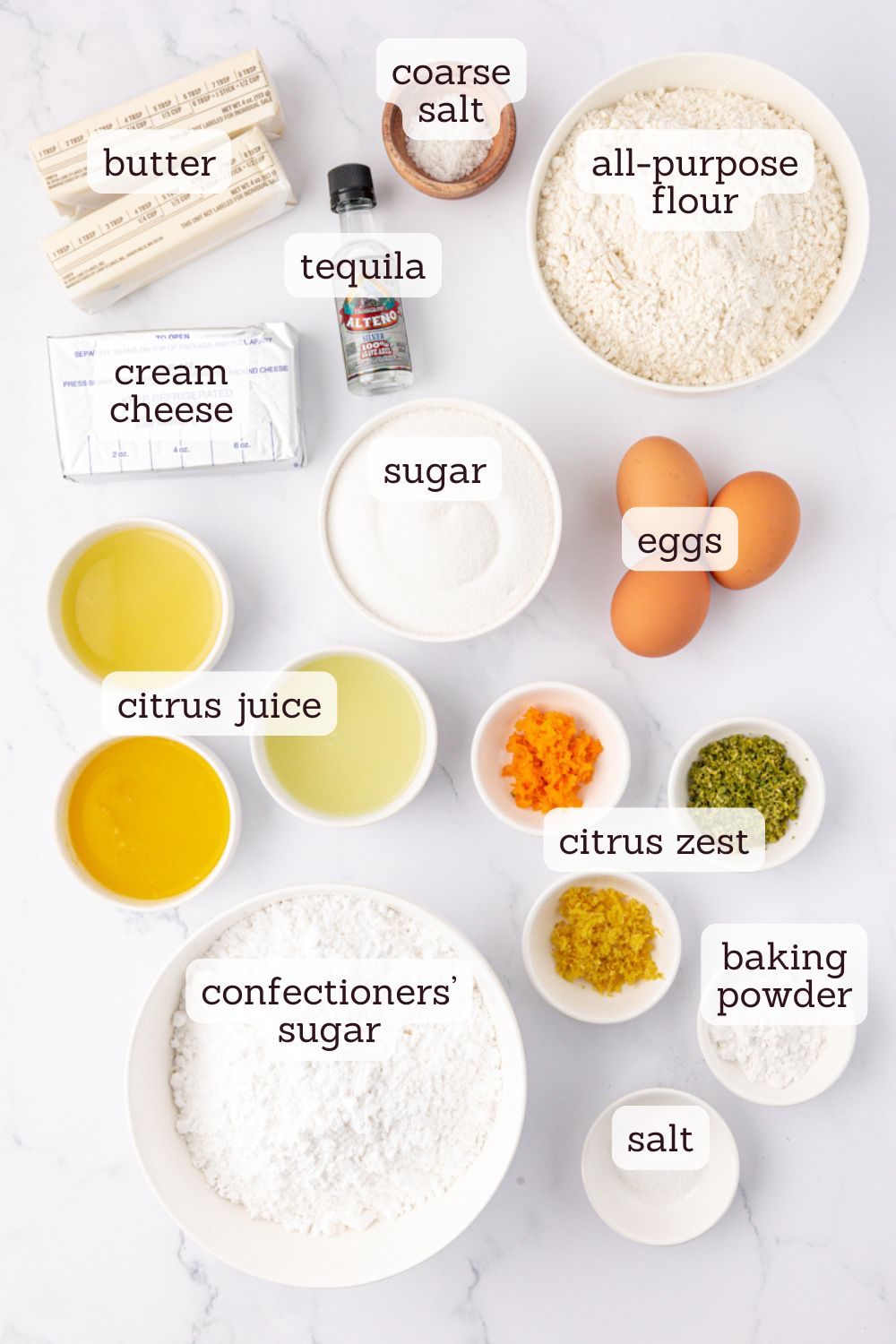 overhead view of ingredients for citrus cake with tequila lime frosting