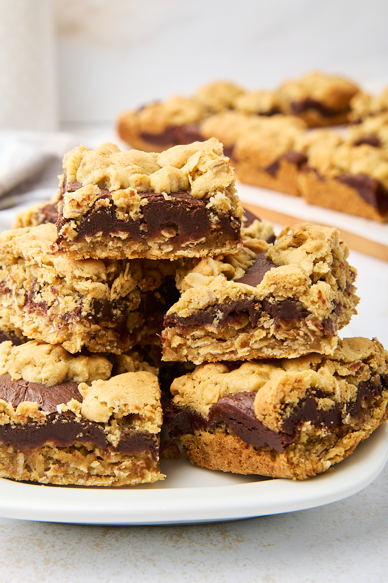 a pile of revel bars on a white plate