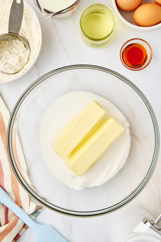 overhead view of butter and sugar in a mixing bowl