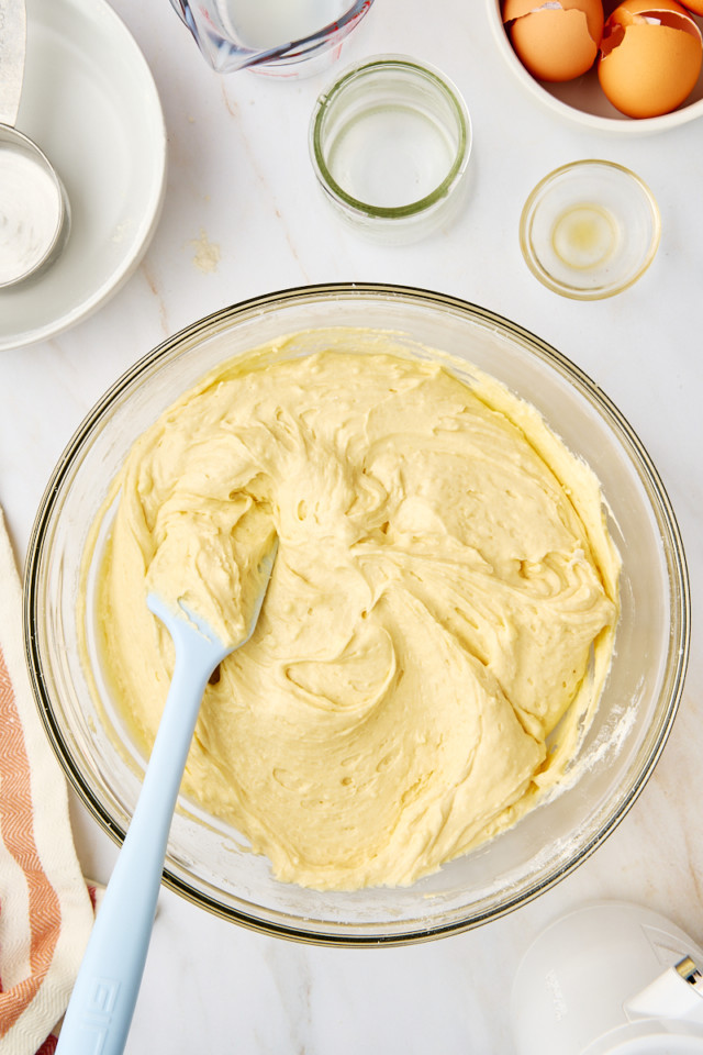 overhead view of yellow cake batter in a mixing bowl