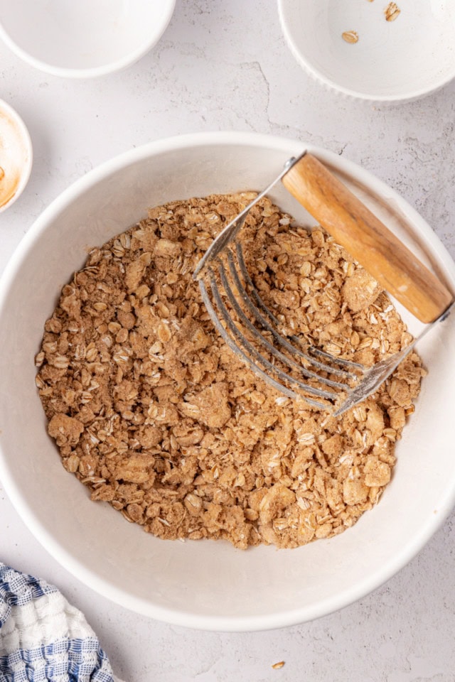 overhead view of mixed berry crisp topping in a white bowl