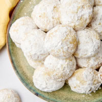 lemon cooler cookies piled on a green plate