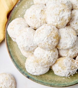 lemon cooler cookies piled on a green plate