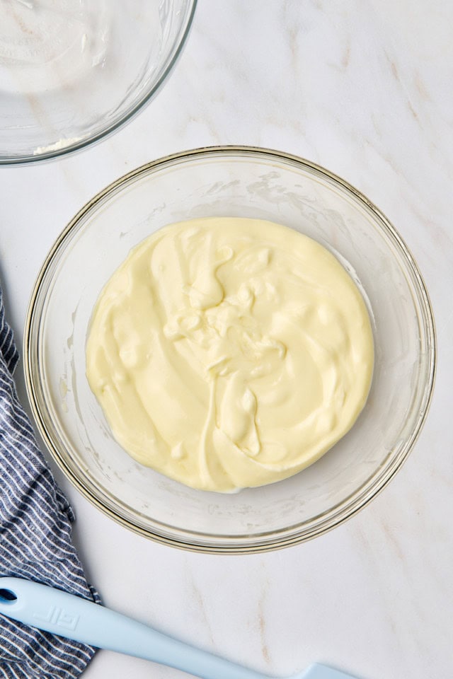 overhead view of white chocolate mousse mixture in a glass bowl