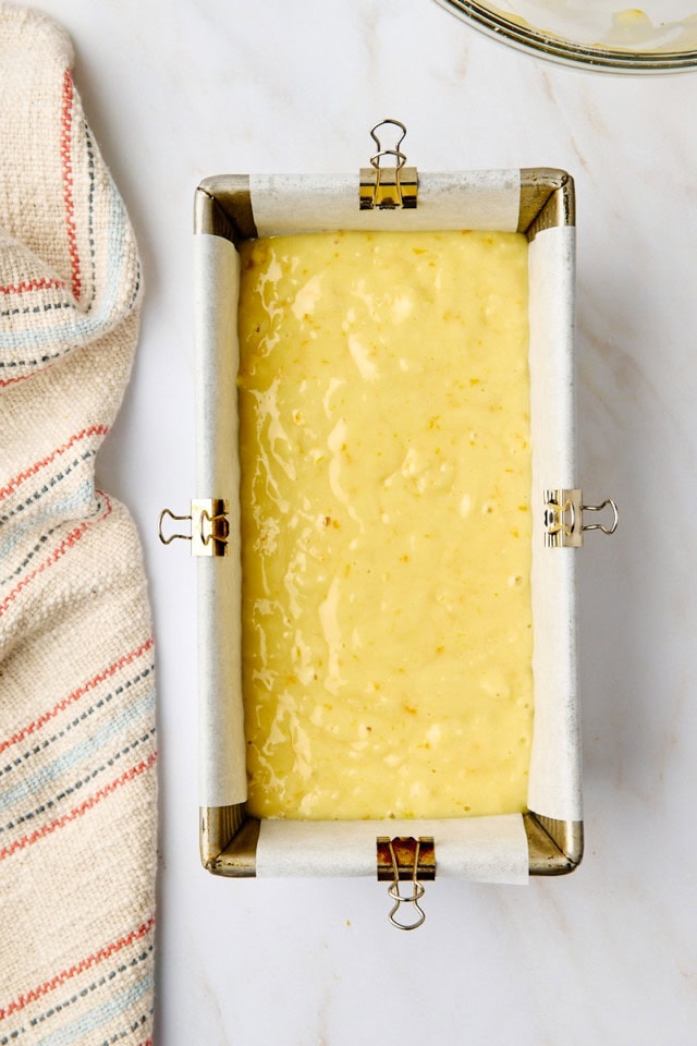 overhead view of yogurt cake in a metal loaf pan ready to go into the oven