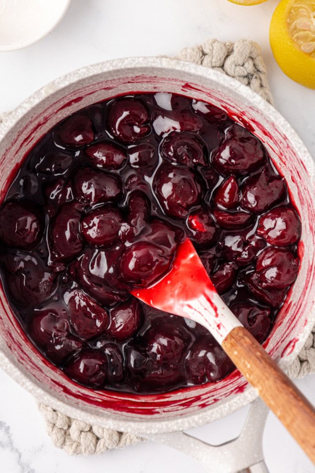 overhead view of cherry topping for cherry cheesecake bars