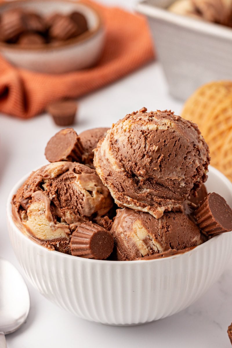 a bowl with several scoops of chocolate peanut butter ice cream