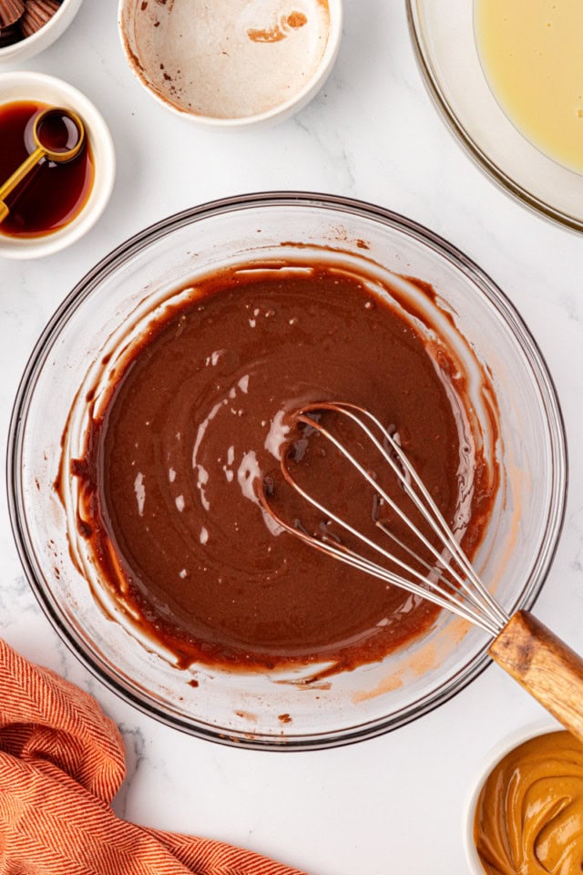 overhead view of combined chocolate ice cream base in a glass mixing bowl