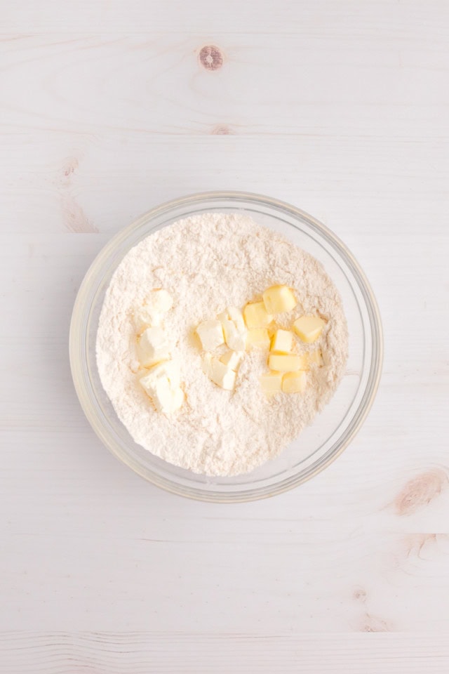 overhead view of butter added to dry ingredients for cobbler topping