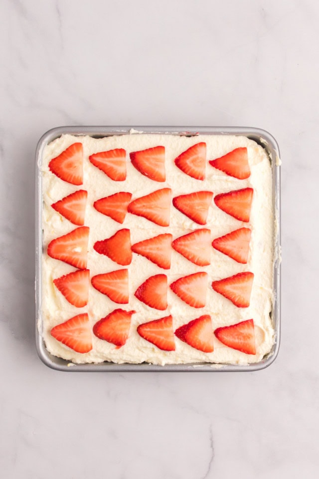 overhead view of assembled strawberry tiramisu ready to go into the refrigerator