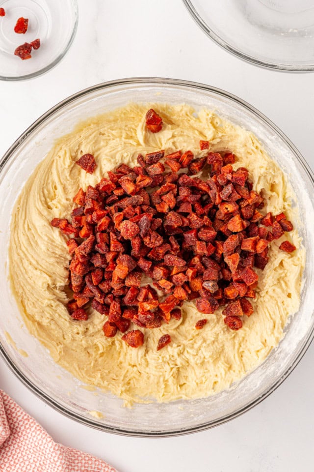 overhead view of chopped dried strawberries added to cream cheese cookie dough