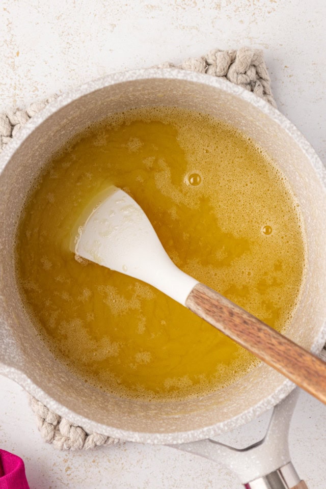 overhead view of melted white chocolate and butter in a saucepan