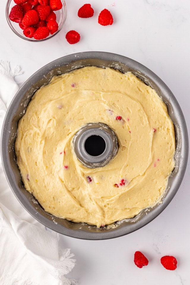 overhead view of raspberry Bundt cake batter in a Bundt pan ready to go into the oven