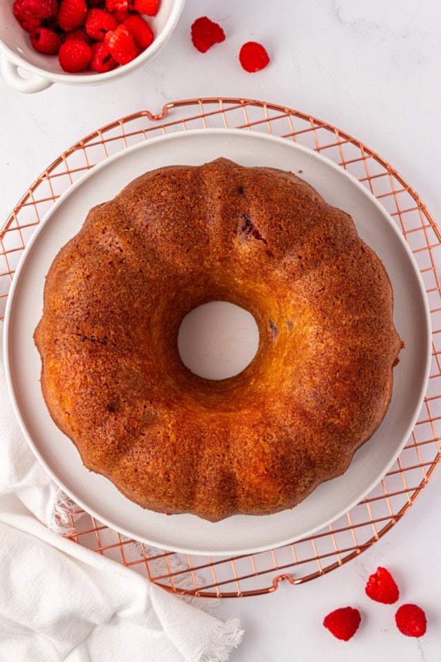 overhead view of raspberry Bundt cake removed from the pan and cooling on a wire rack