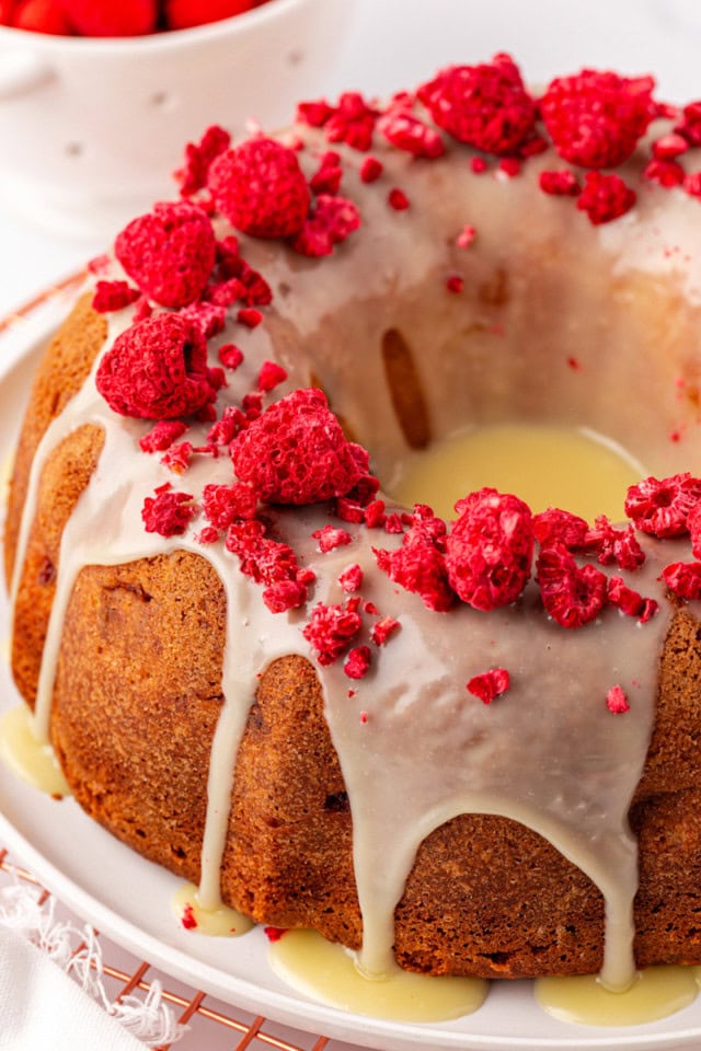 raspberry Bundt cake topped with white chocolate ganache and garnished with freeze-dried raspberries