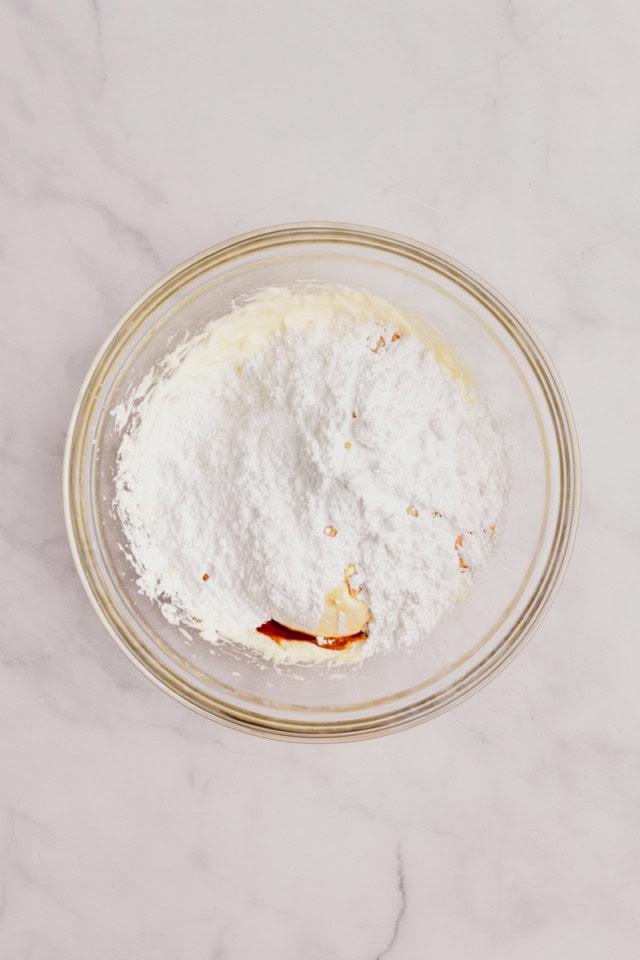 overhead view of marshmallow creme, confectioners' sugar, vanilla, and salt added to creamed butter
