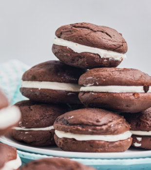 several whoopie pies in a mounded stack on a blue plate
