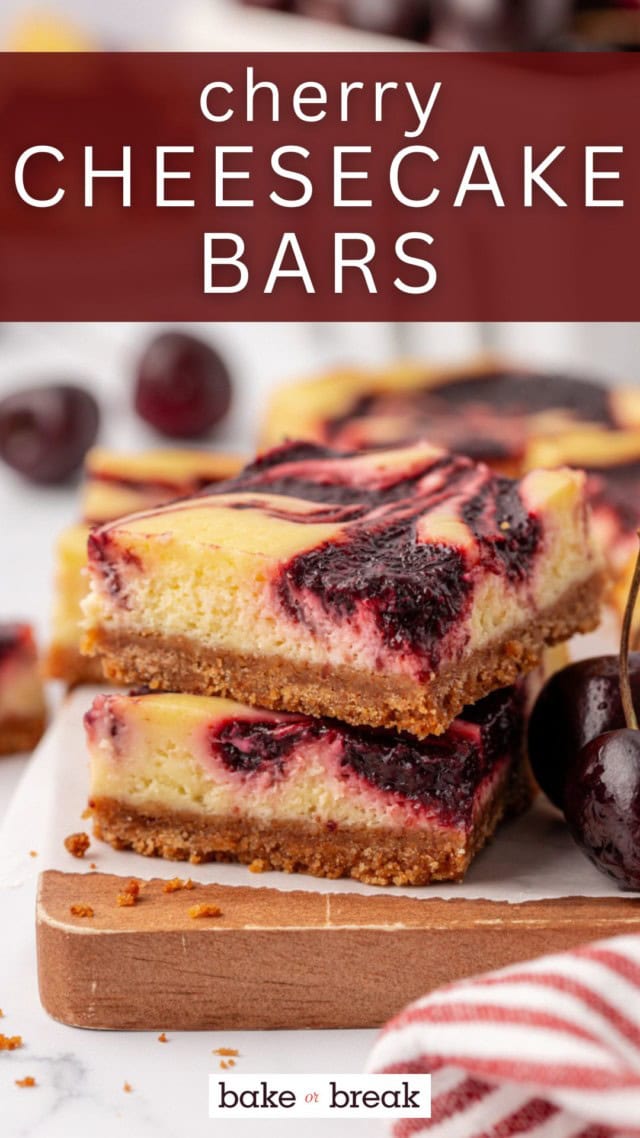 stack of two cherry cheesecake bars on a wooden board; text overlay "cherry cheesecake bars"