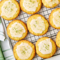 overhead view of glazed coconut lime cookies on a wire rack