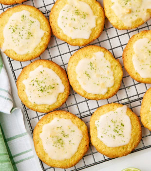 overhead view of glazed coconut lime cookies on a wire rack