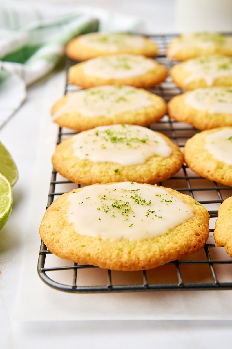 coconut lime cookies topped with a lime glaze on a wire rack