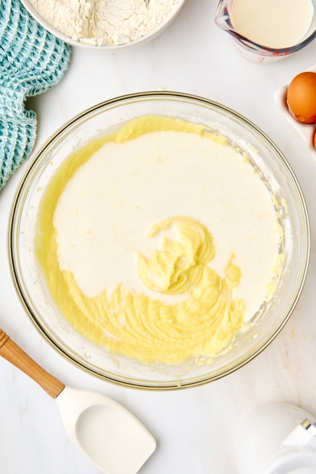 overhead view of milk mixture added to five flavor pound cake batter