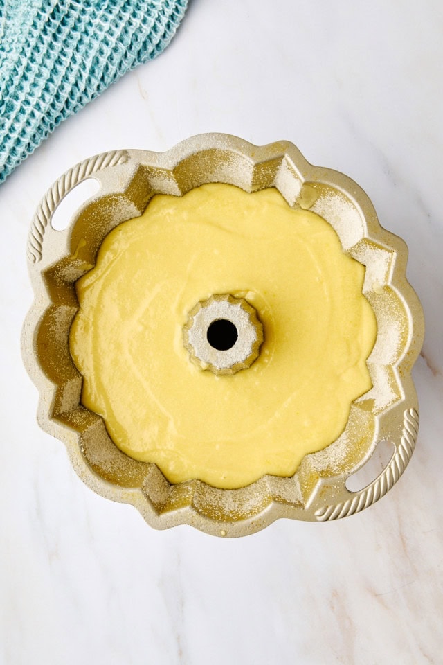 overhead view of five flavor pound cake batter in a Bundt pan ready to go into the oven