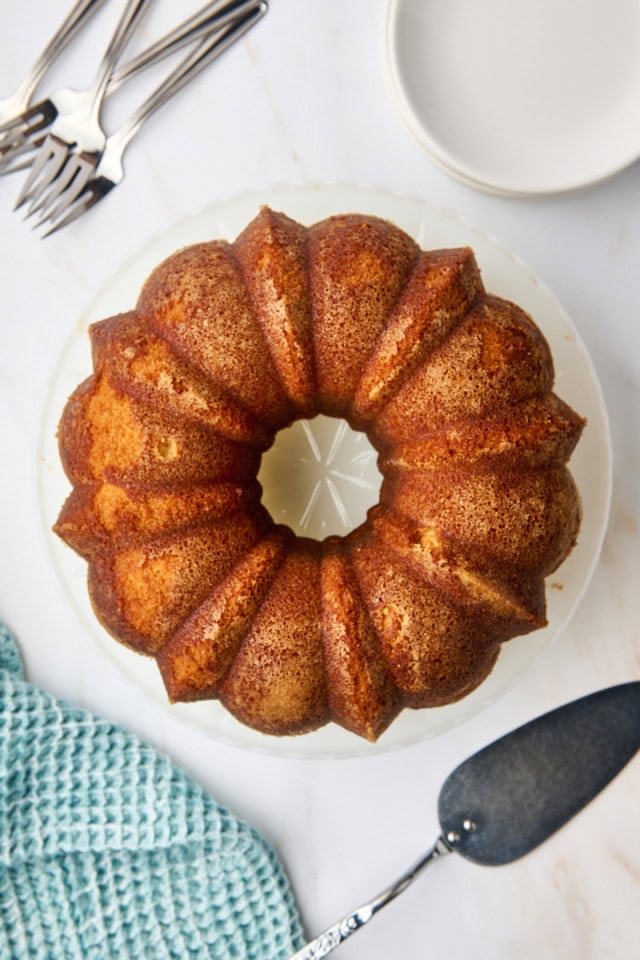 overhead view of five flavor pound cake on a white cake stand