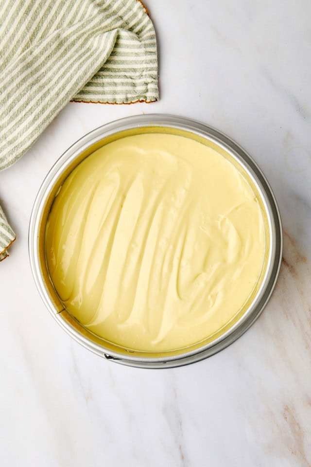 overhead view of New York cheesecake batter in a springform pan ready to go into the oven