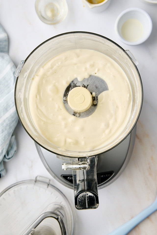 overhead view of ricotta mousse in the bowl of a food processor
