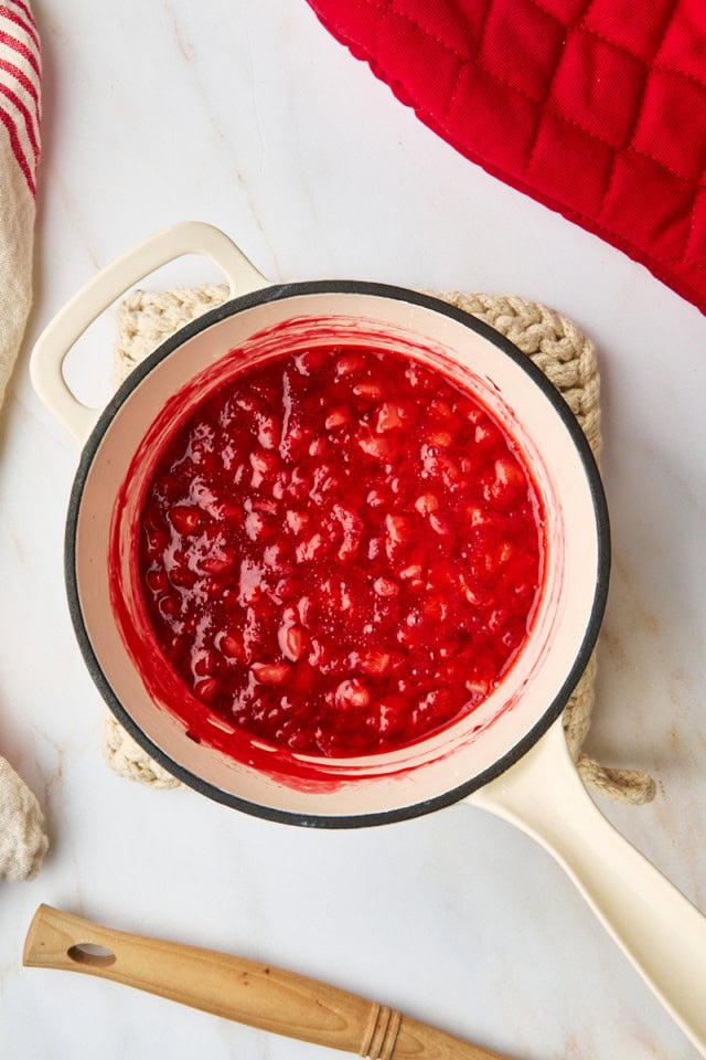 overhead view of cooked strawberry topping in a saucepan