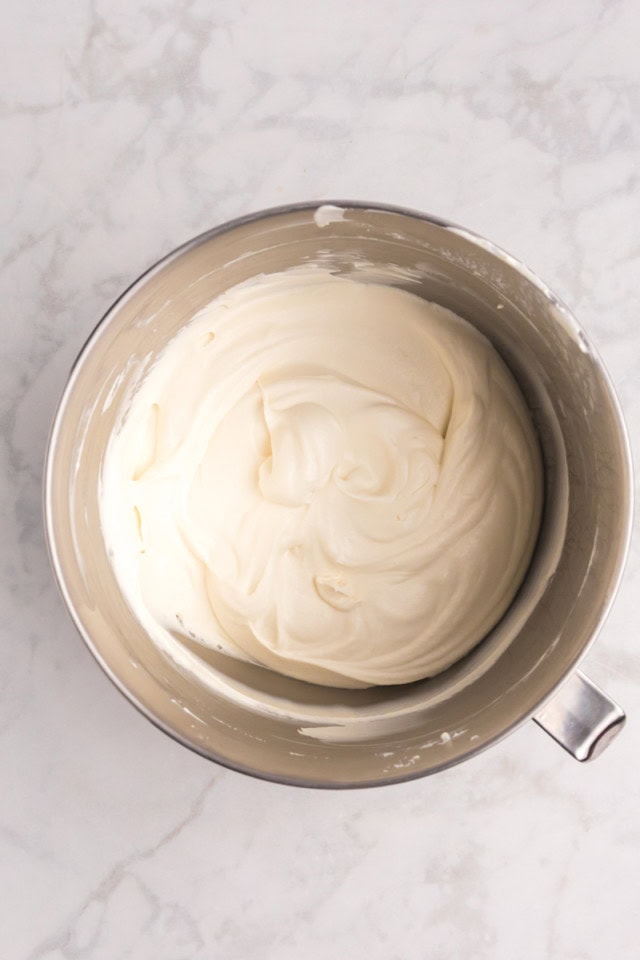overhead view of vanilla ice cream base for all the cookies ice cream in a metal mixing bowl