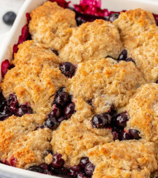 blueberry cobbler in a white baking dish