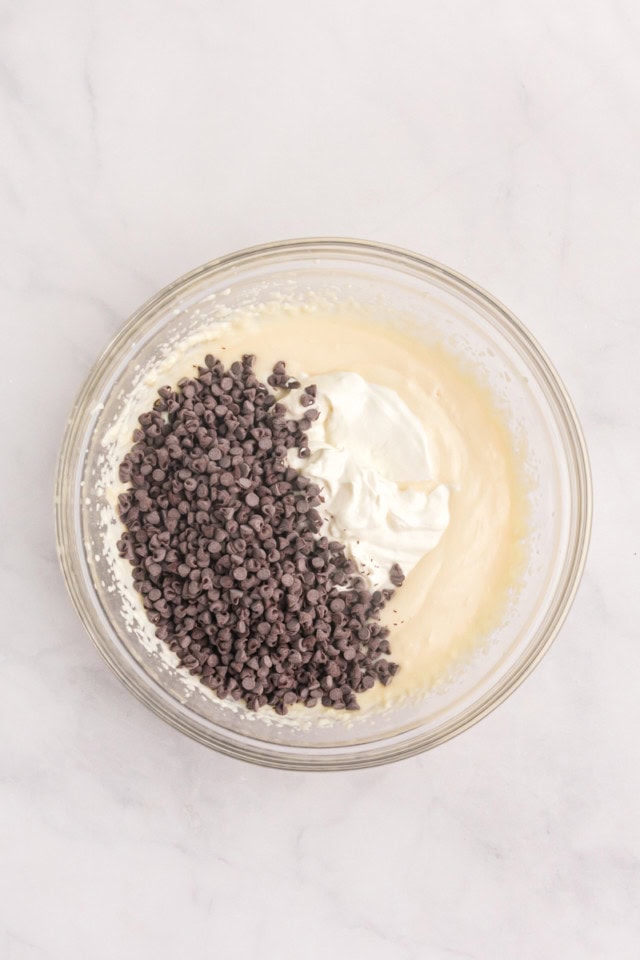 overhead view of yogurt and chocolate chips added to ricotta mixture