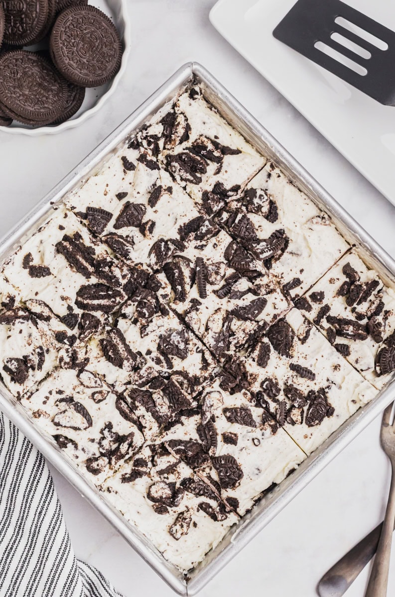 overhead view of sliced Oreo cheesecake bars in the pan