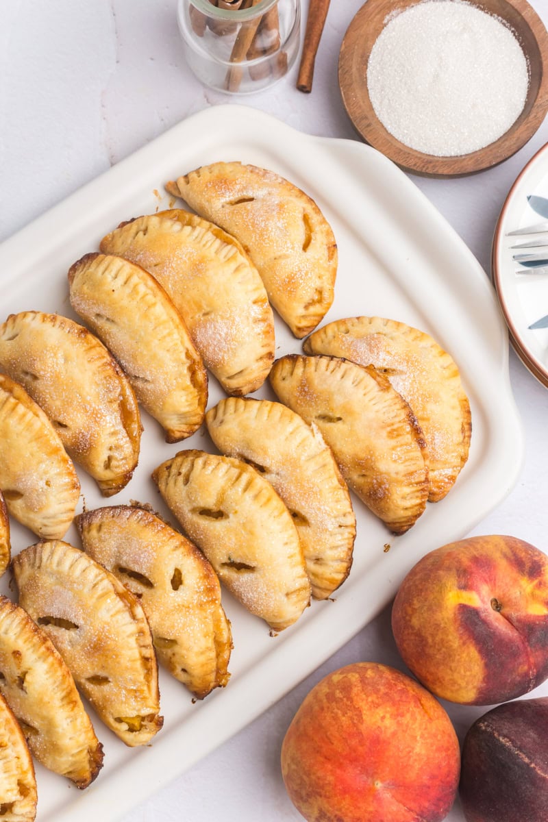 peach hand pies on a white serving tray