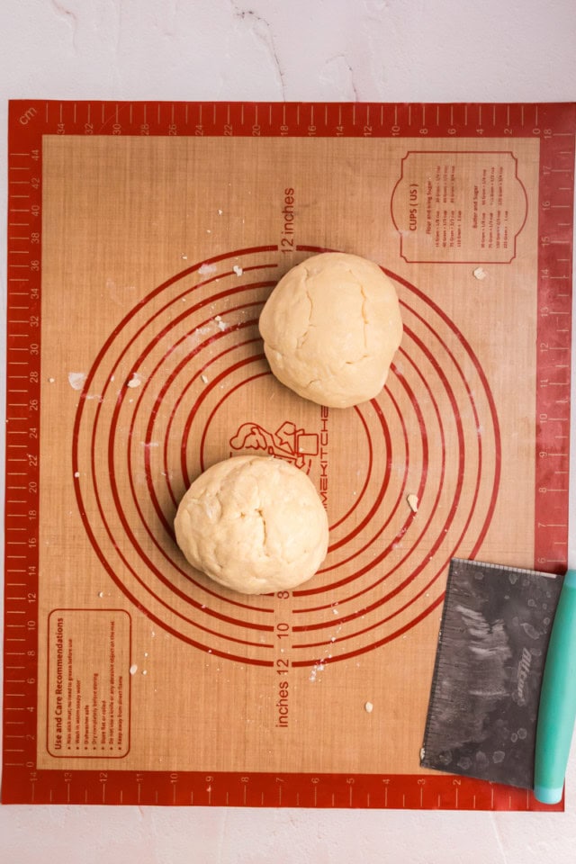 overhead view of cream cheese pastry dough on a silicone rolling mat