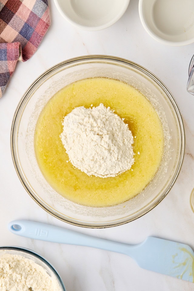overhead view of dry ingredients added to wet ingredients for muffin batter