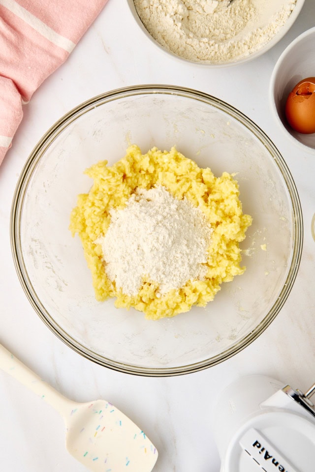 overhead view of dry ingredients added to wet ingredients for Neapolitan cookies