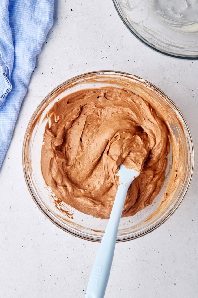 overhead view of no-bake chocolate cheesecake batter in a glass bowl