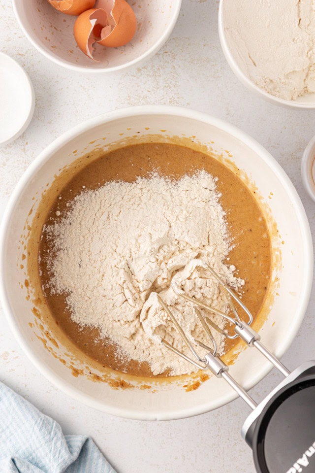 overhead view of dry ingredients added to wet ingredients for brown butter blondies